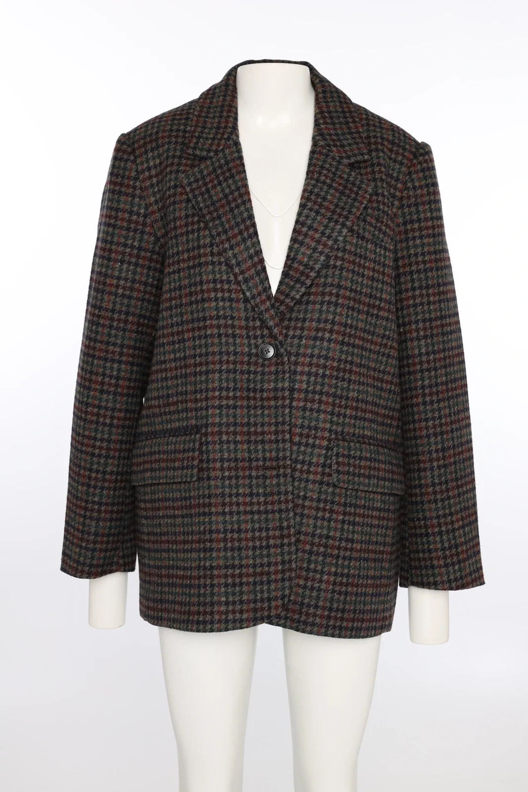 Checkered blazer on a mannequin in the studio