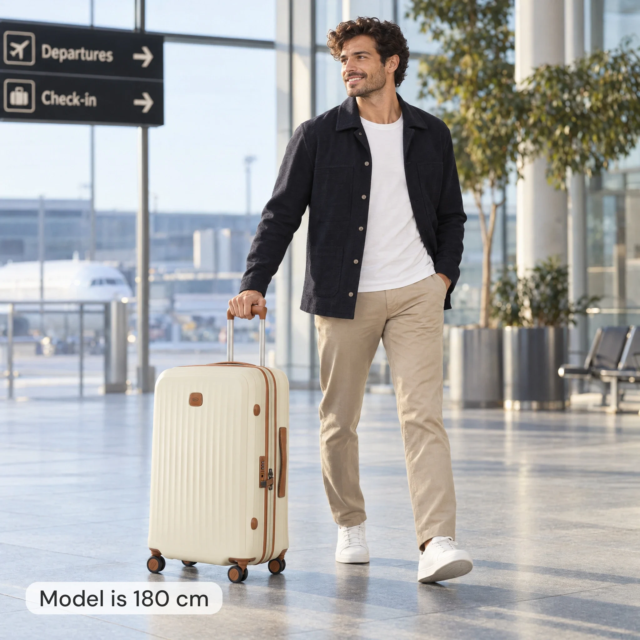 AI-modellbild: man på 180 cm med en ecrufärgad Bric's-resväska som är 69 cm hög