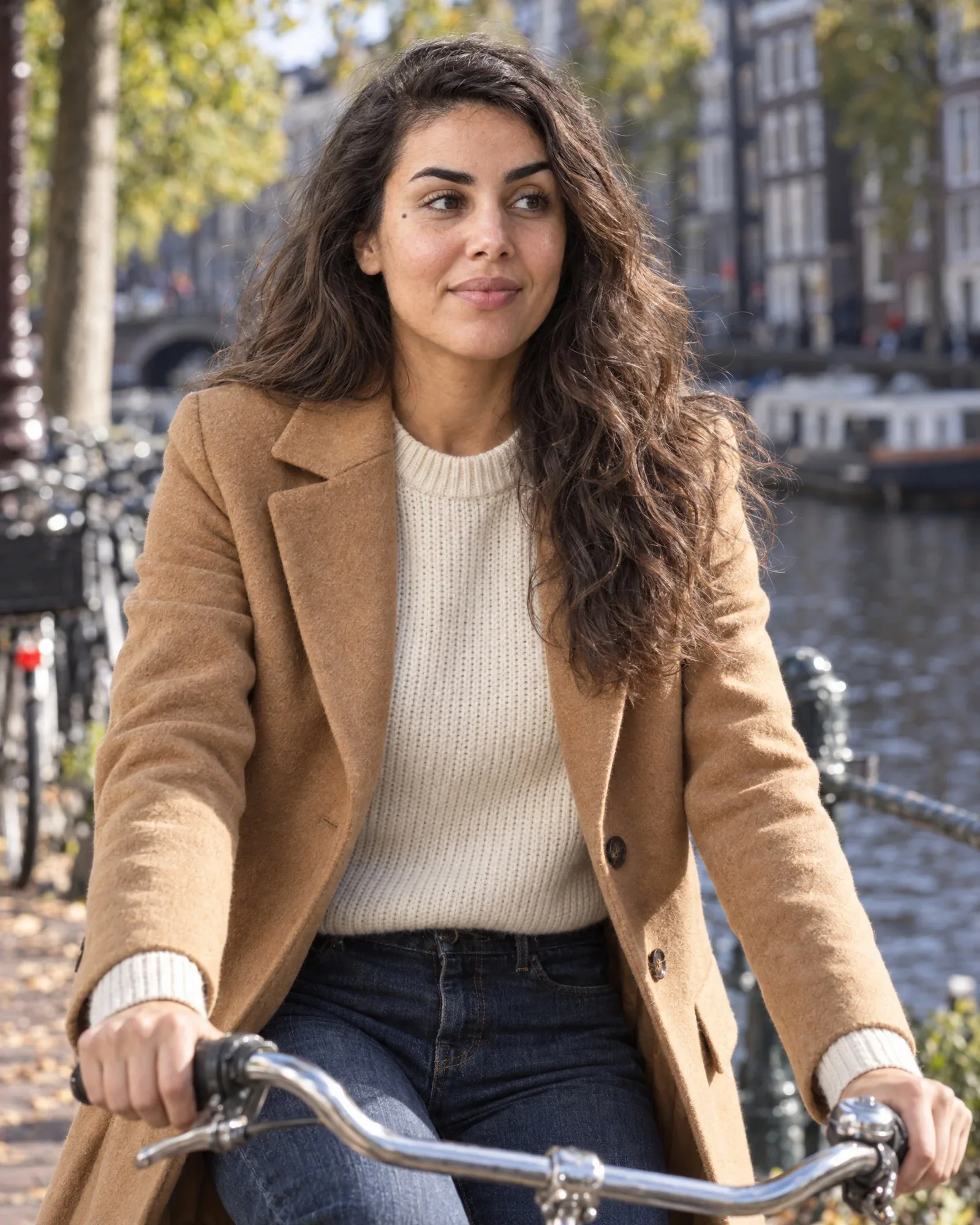 Close-up of Noor in the same camel coat
