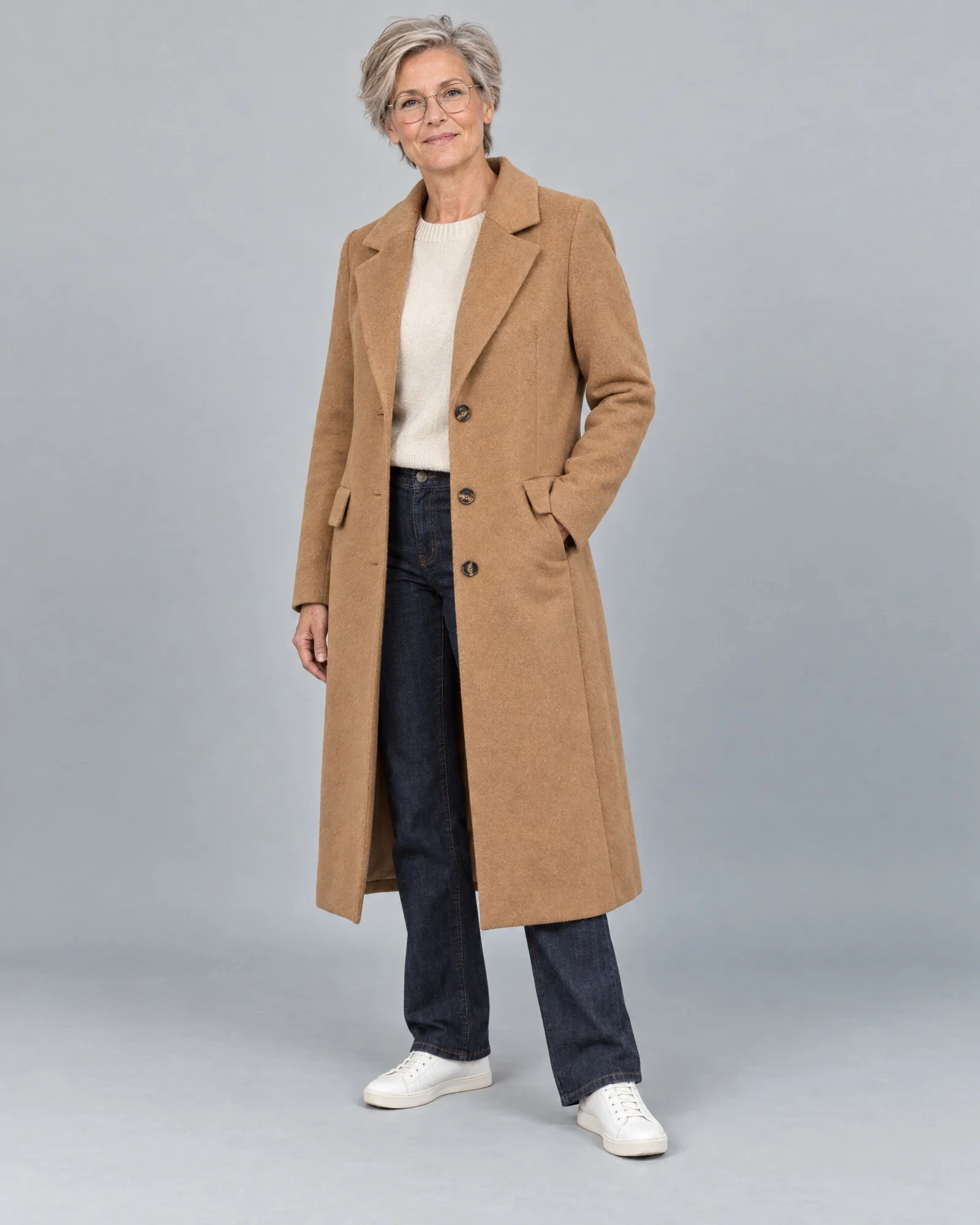 An employee in a camel coat in the in-house studio