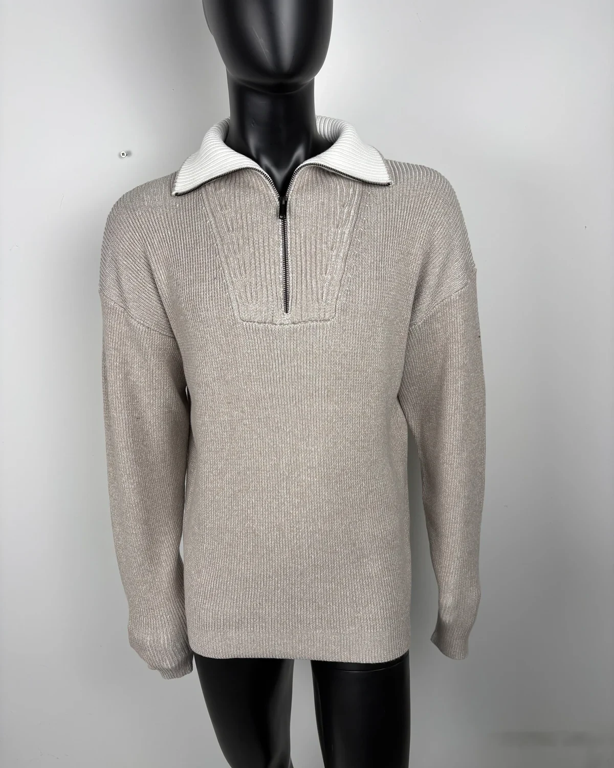 Studio shot of the same sweater on a mannequin